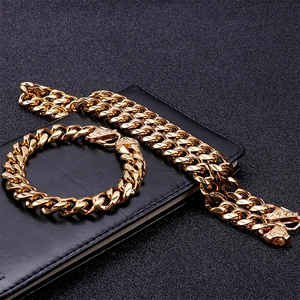 Men's heavy golden stainless steel Cuban link necklace and bracelet set on black leather