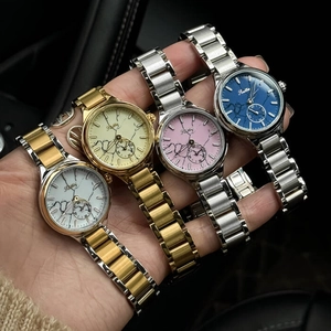 Elegant women's quartz watch with marble dial and metallic strap in four colors