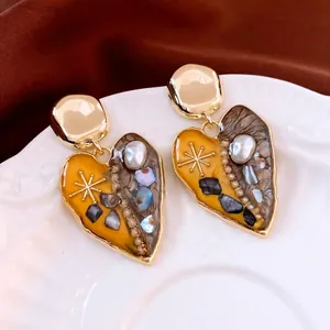 Vintage heart earrings with yellow and grey marble resin inlay and pearl accents