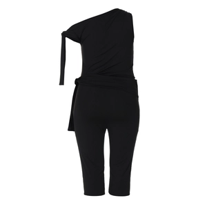 Detail view of black one-shoulder jumpsuit with adjustable shoulder tie and cinched waist