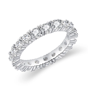 Minimalist silver eternity ring with round-cut clear cubic zirconia on white background