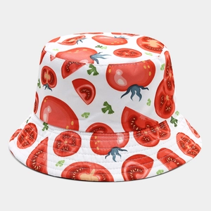 Close-up of tomato print patterns and reinforced stitching on white cotton bucket hat