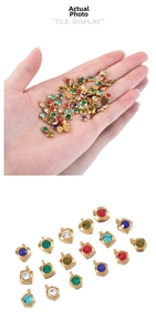 Detail display of geometric heart and square gemstone pendants in assorted colors