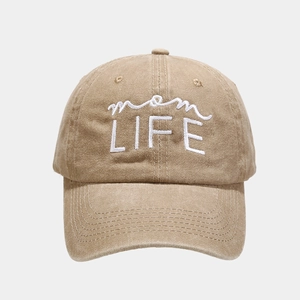 Close-up of khaki washed cotton baseball cap with white mom LIFE embroidery detail