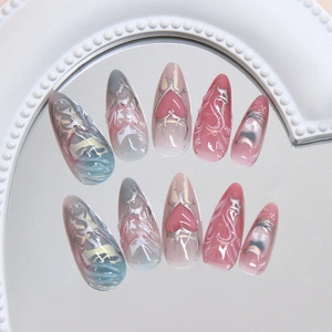 Y2K long almond press-on nails with silver 3D heart chrome and pink gradient finish