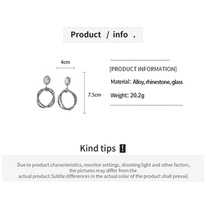 Detail view of geometric rhinestone earrings showing 4cm width and 7.5cm height specs