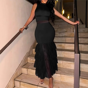 Detail of elegant black sleeveless dress with layered mesh mermaid hem and slim fit