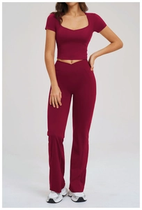 Front view of burgundy yoga set with sweetheart neck top and flared high-waist pants