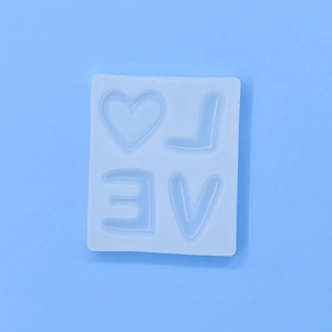 Silicone LOVE heart letter mold for DIY cake, soap, and candle making on blue background