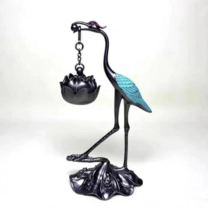 Detailed antique bronze crane incense burner with hanging lotus pod and wing texture