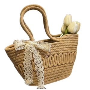 French straw bucket bag with lace bow decoration and tulip insert in beige