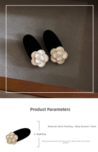 Detail of camellia hair clips showing velvet texture, pearls and size dimensions
