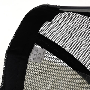 Detail of western trucker hat inner sweatband, mesh fabric and washing label