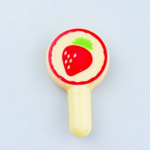 Macro shot of a lollipop-shaped creative toy pen featuring a red strawberry pattern