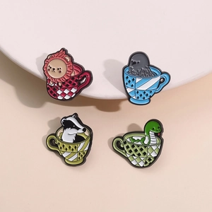 Cartoon animal enamel pins set featuring a lion, raven, badger, and snake in tea cups