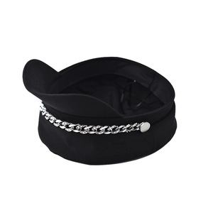 Detailed view of black beret with a silver rhinestone chain and metallic side buttons
