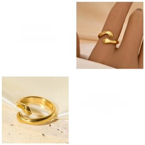 Close-up of golden stainless steel hug ring showing detailed hand-shaped opening