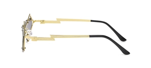 Detail of trendy gold sunglasses featuring unique lightning bolt shaped metal temples