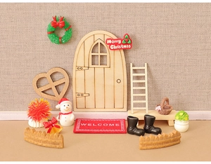 Miniature Christmas elf door set with snowman wreath and holiday dollhouse accessories