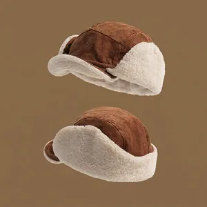 Brown corduroy aviator hat with warm sherpa fleece lining and ear flaps for winter