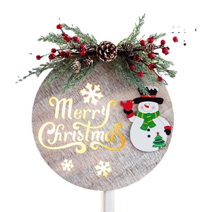 Wooden Merry Christmas door hanger with snowman, pine cones, and gold lettering