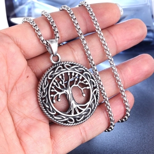 Polished stainless steel Tree of Life pendant necklace with Celtic knot patterns