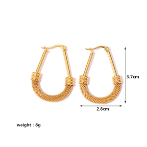 Detail view of gold braided hoop earrings measuring 3.7cm in height and 2.8cm in width
