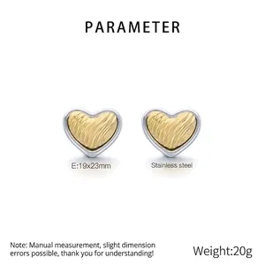 Detail view of heart-shaped 18K gold plated stainless steel earrings with textured finish