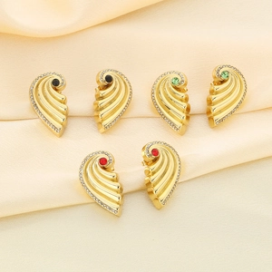 Luxurious gold spiral feather earrings with crystal edges and red, green, black gemstones