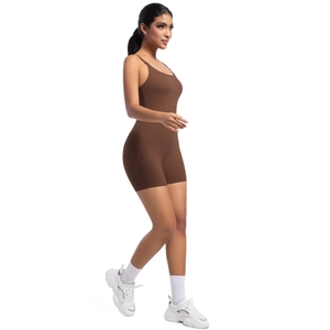 Close-up of slim straps and sleek chocolate brown material on a yoga bodysuit