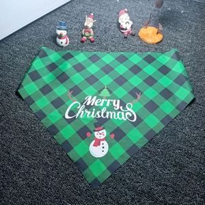 Green and black plaid pet Christmas bandana with snowman print on grey background