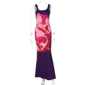 Close-up of sleeveless maxi dress featuring purple gradient and large pink floral print