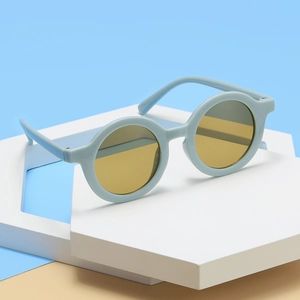 Cute round frame kids sunglasses with mint green frame and yellow lenses for UV protection