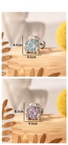 Detail view of snake-shaped zircon stud earrings in light blue and purple colors