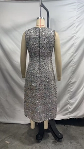 Detail view of silver sleeveless sequined midi dress with hidden back zipper on mannequin
