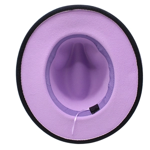 Detail view of the purple wool fedora interior showing the black trim and fabric texture