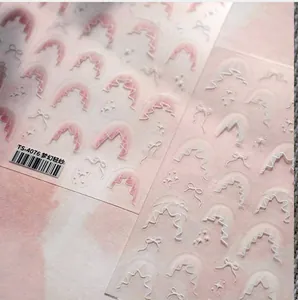 Macro detail of TS-4076 nail stickers with 3D pink lace, bows and dreamy gauze texture
