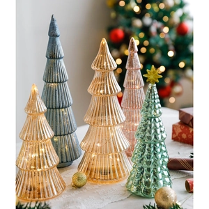 Lighted glass Christmas tree ornaments in amber and pink colors for table decoration
