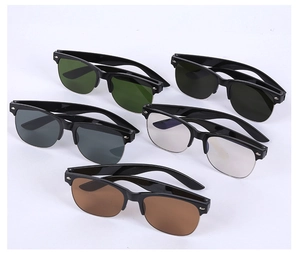 Close-up of five pairs of semi-rimless sunglasses in various lens colors on white background