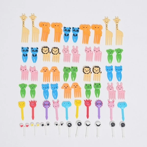 Close-up of colorful cartoon animal food picks for kids including panda and giraffe shapes