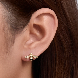 Exquisite handmade gold bee stud earrings with shimmering crystals and black enamel stripes