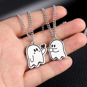 Matching couple necklaces with cute white enamel heart-holding ghost pendants on silver chains