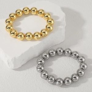 Bracciali con perle a sfera lucide color oro e argento con chiusura regolabile