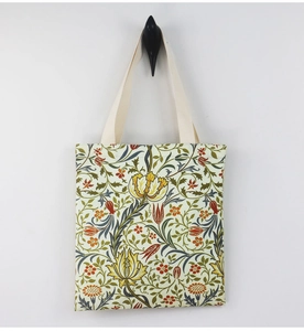 Close-up of William Morris floral canvas tote featuring vibrant botanical prints