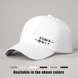 Adjustable white cotton baseball cap with Don't Quit printed text in multiple colors
