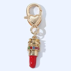 Lipstick keychain with red enamel, golden metal, and colorful rhinestones for women