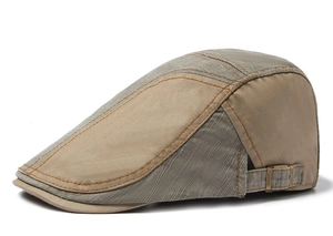 Detail view of the cotton patchwork ivy cap showing side stitching and metal buckle
