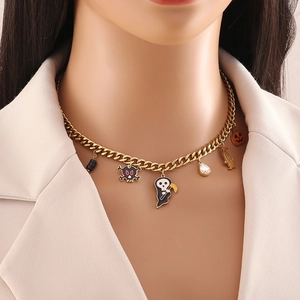 Colorful Halloween necklace with skull and ghost charms on gold stainless steel chain