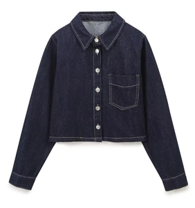 Detailed flat lay of dark blue denim jacket with metal buttons and chest pocket