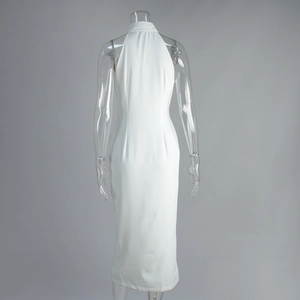 Detail of white halter neck midi dress showing a sleek back design and woven fabric